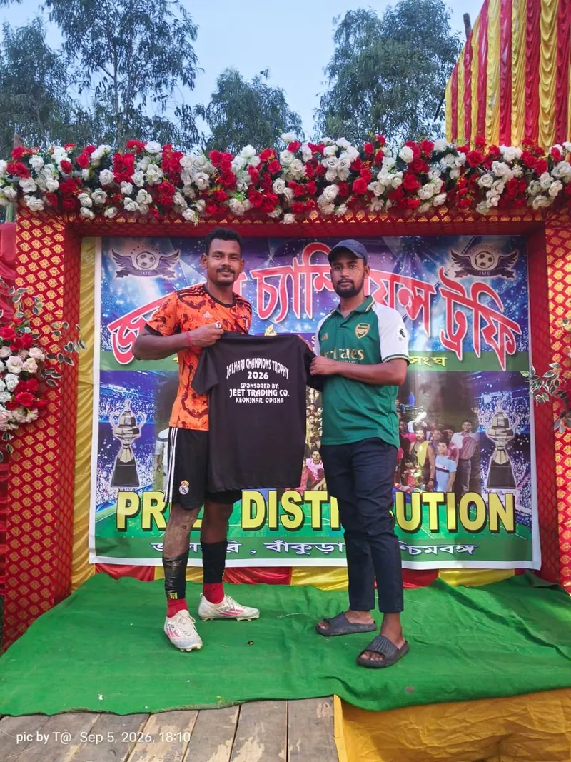 A winning player holding a Jeet Trading Co.-branded jersey at the Jalhari Champions Trophy 2026