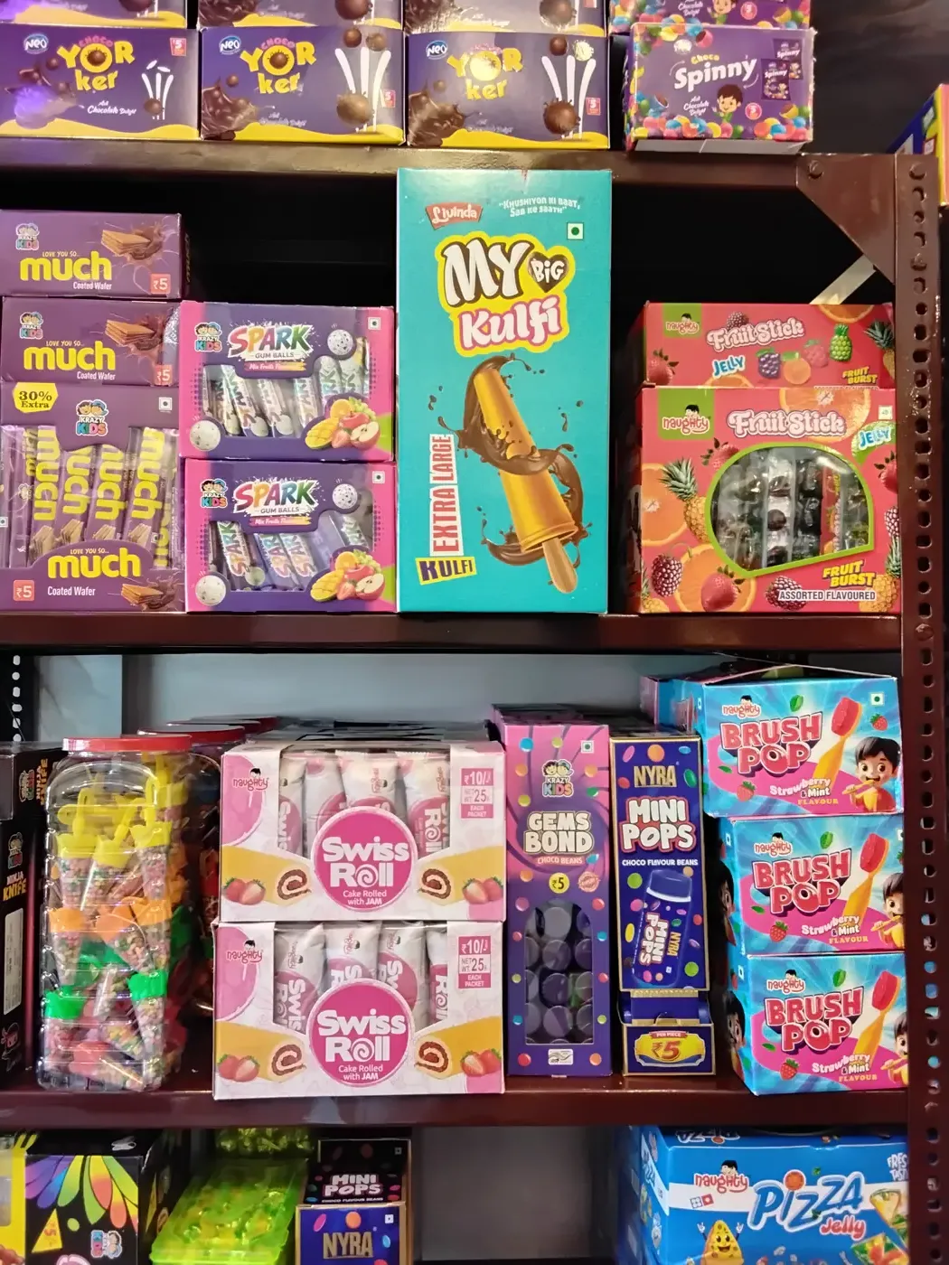 Kids candy and wafer assortment including Yorker, Choco Spinny and Swiss Roll